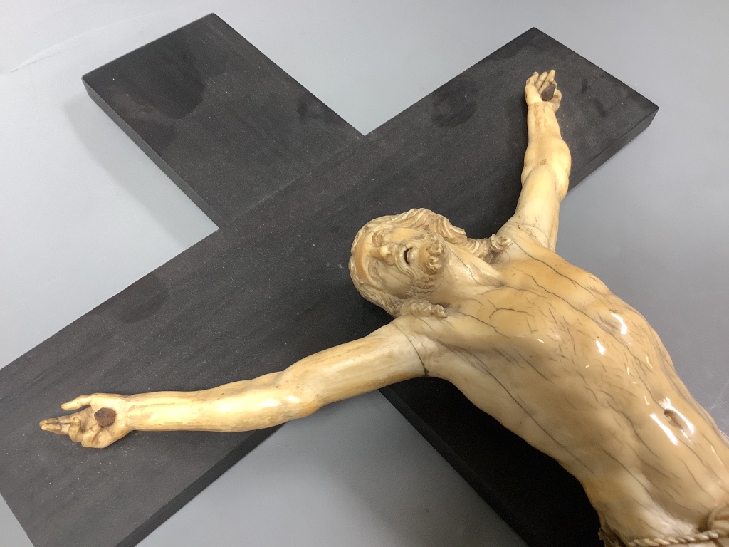 A 19th century Dieppe carved ivory and ebony crucifix, overall length 48cm